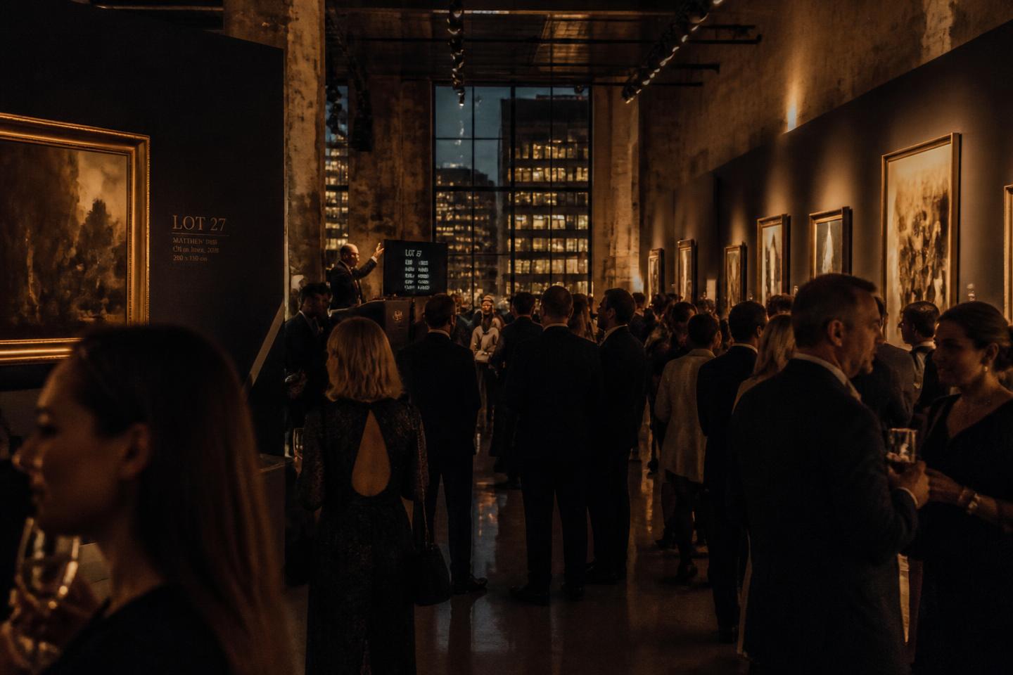 Guests at a UFOUND auction evening in a converted city-centre hall